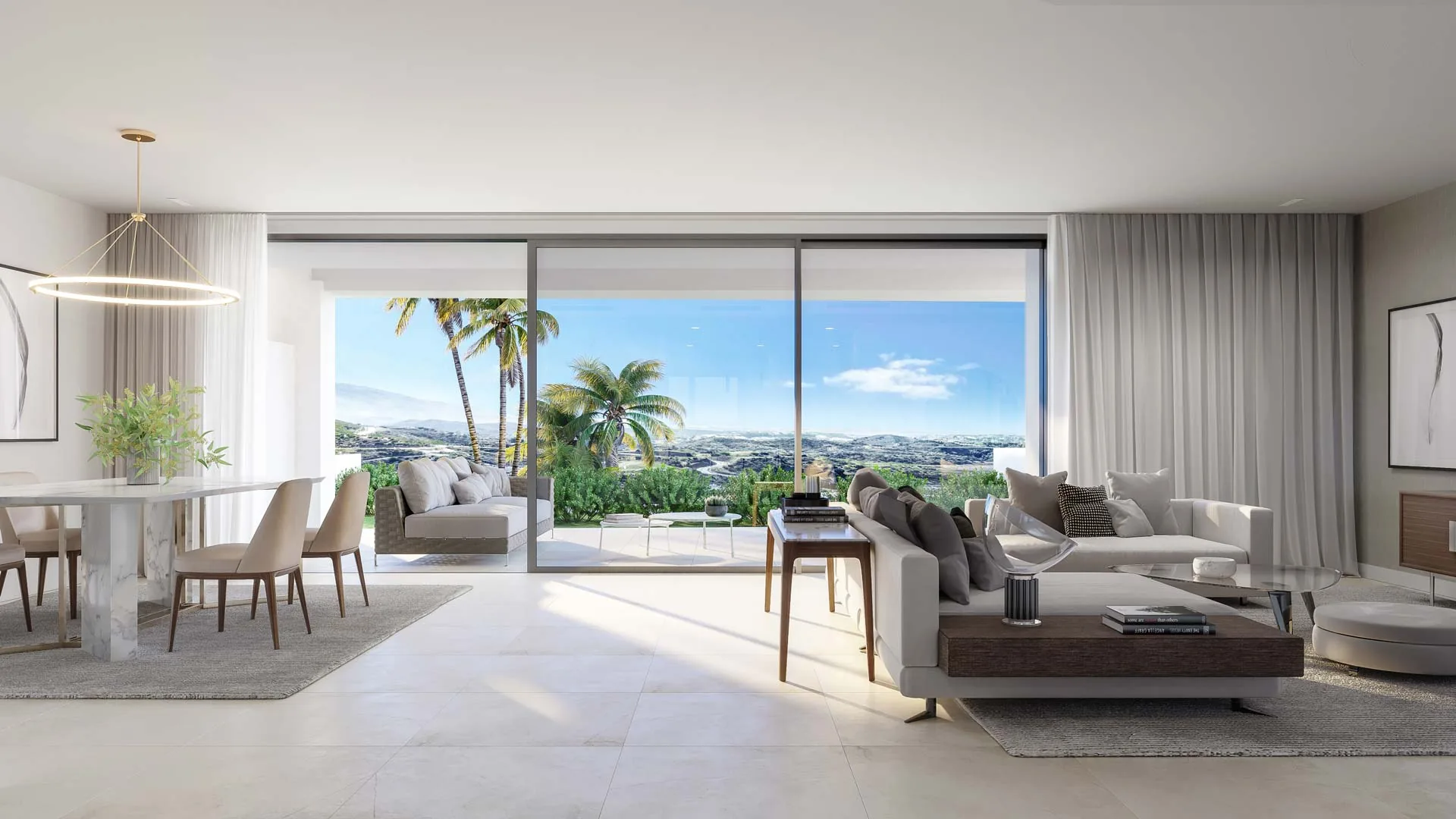Living room opening onto a terrace with sea views